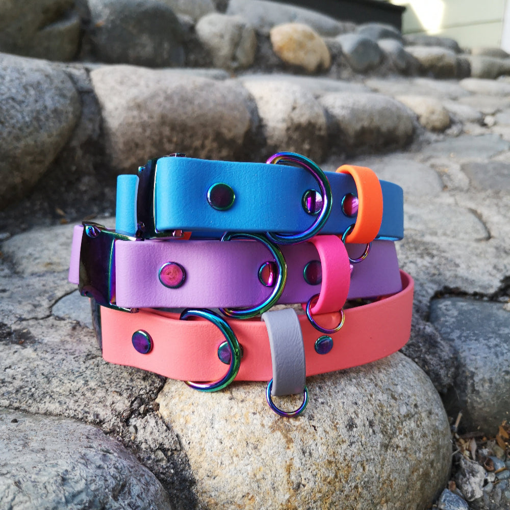Top to bottom: Cobalt blue (no longer offered) & neon orange strap. Amethyst and Magenta pink strap. Coral pink and grey strap.