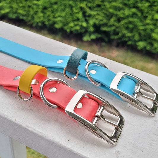 Sky blue and hunter green strap keeper.  Coral pink with yellow strap keeper 