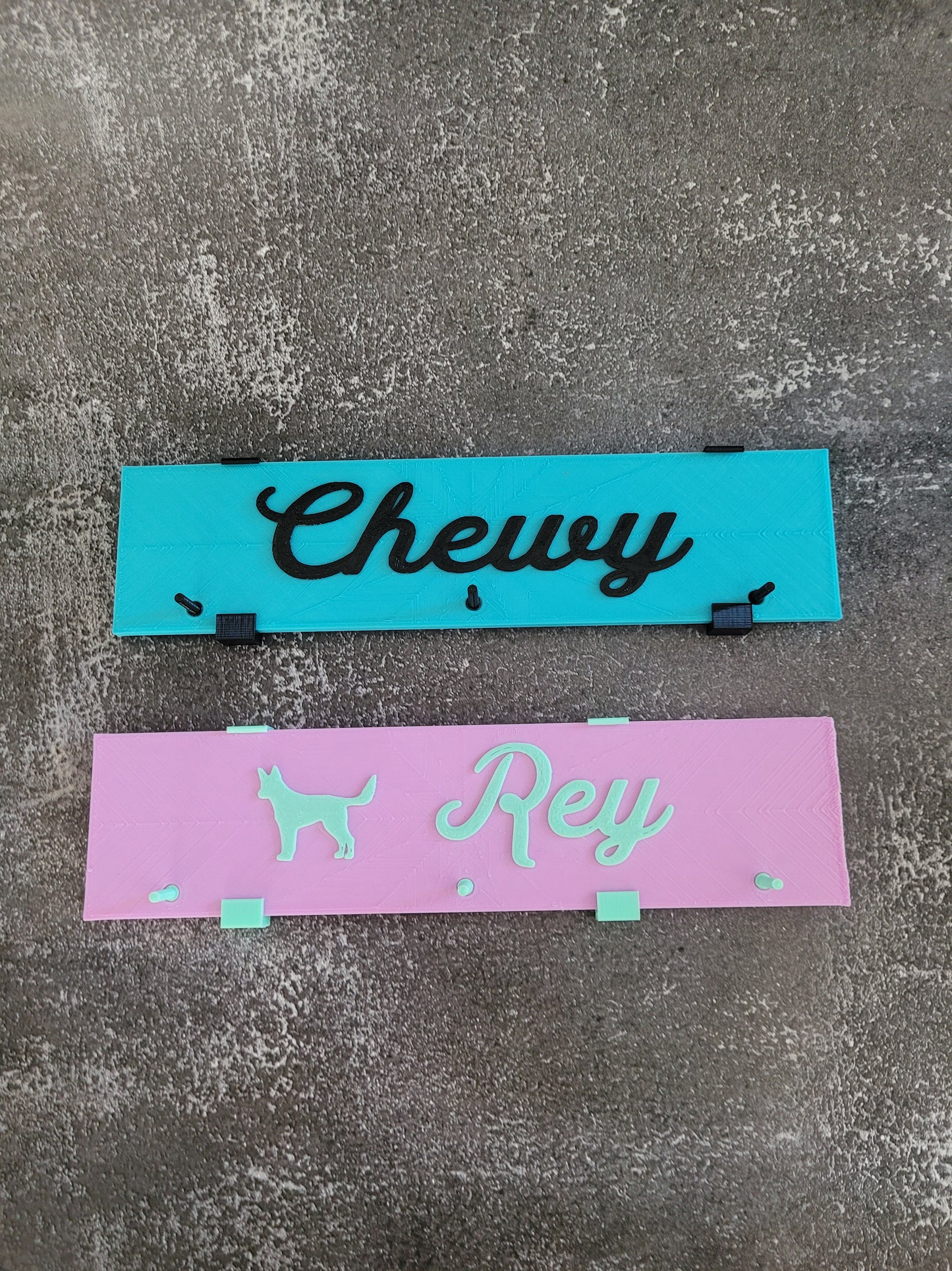 Chewy is turquoise and black. Rey is lavender and mint