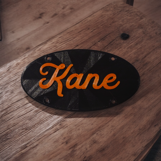 Black plate,  orange font 