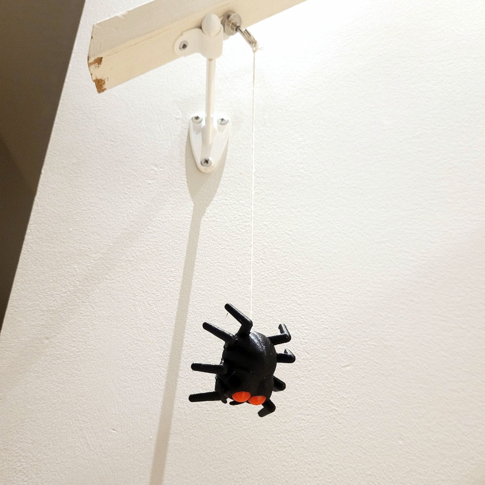 Magnetic hook and string not included.  A hole is still available in the back to attach your own string.