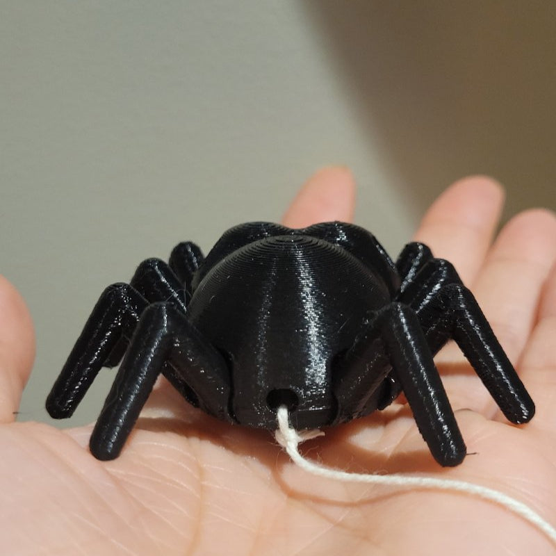 Magnetic hook and string not included.  A hole is still available in the back to attach your own string.