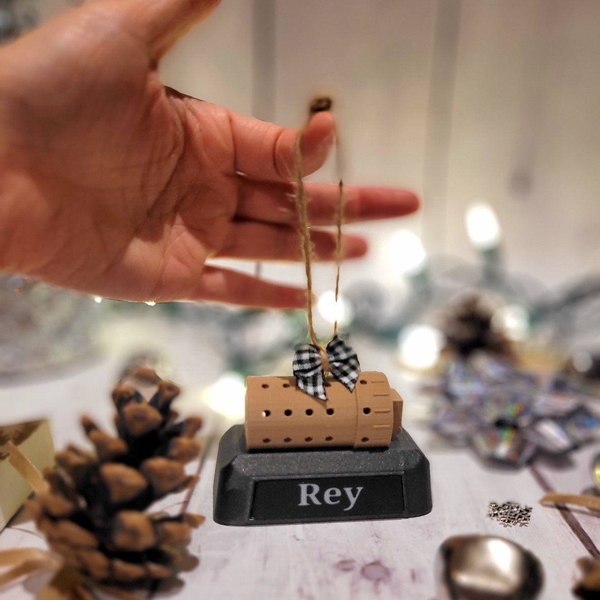 Shown with the black & white bow. The name plate is black & the font is white. The base is a sparkle black hence it looks a bit lighter against the black plate.