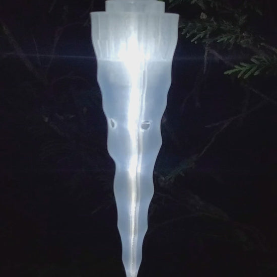 This is a single Icicle Vessel that has a metal hook and is lit up at night.