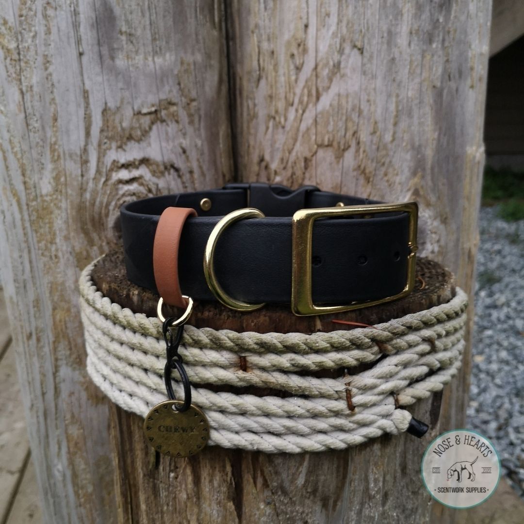 Black and brass hardware with a brown (light tan) strap keeper