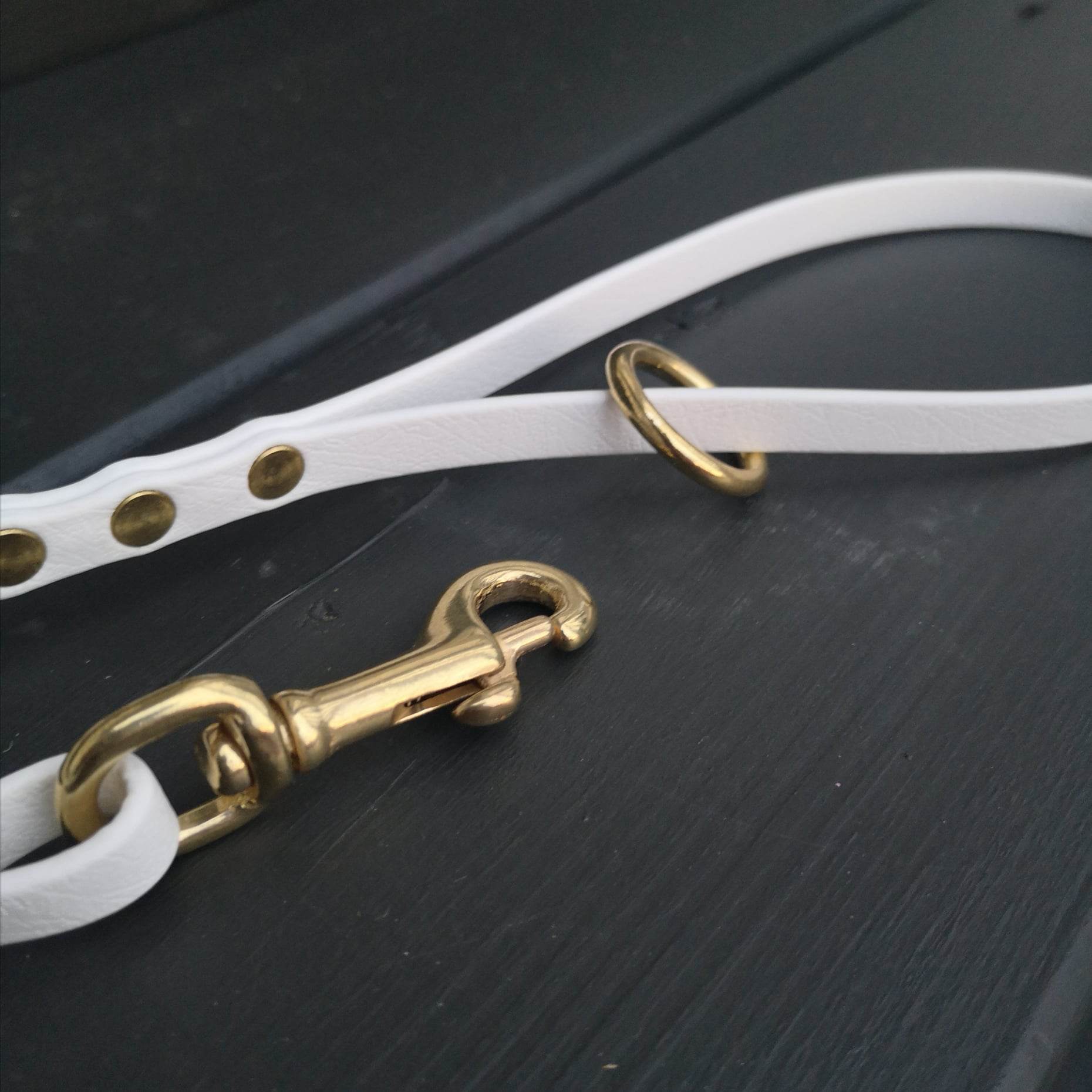 White with a traditional handle loop + ring