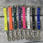 Straight tabs with a ring.  From Left to right: Neon yellow, Neon Orange, Hunter Green, Purple, Magenta Pink, White, Black and Royal blue.