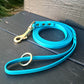 Blue lagoon and brass hardware. Traditional handle loop with a ring