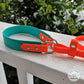 Teal main colour with neon orange as the accent colour