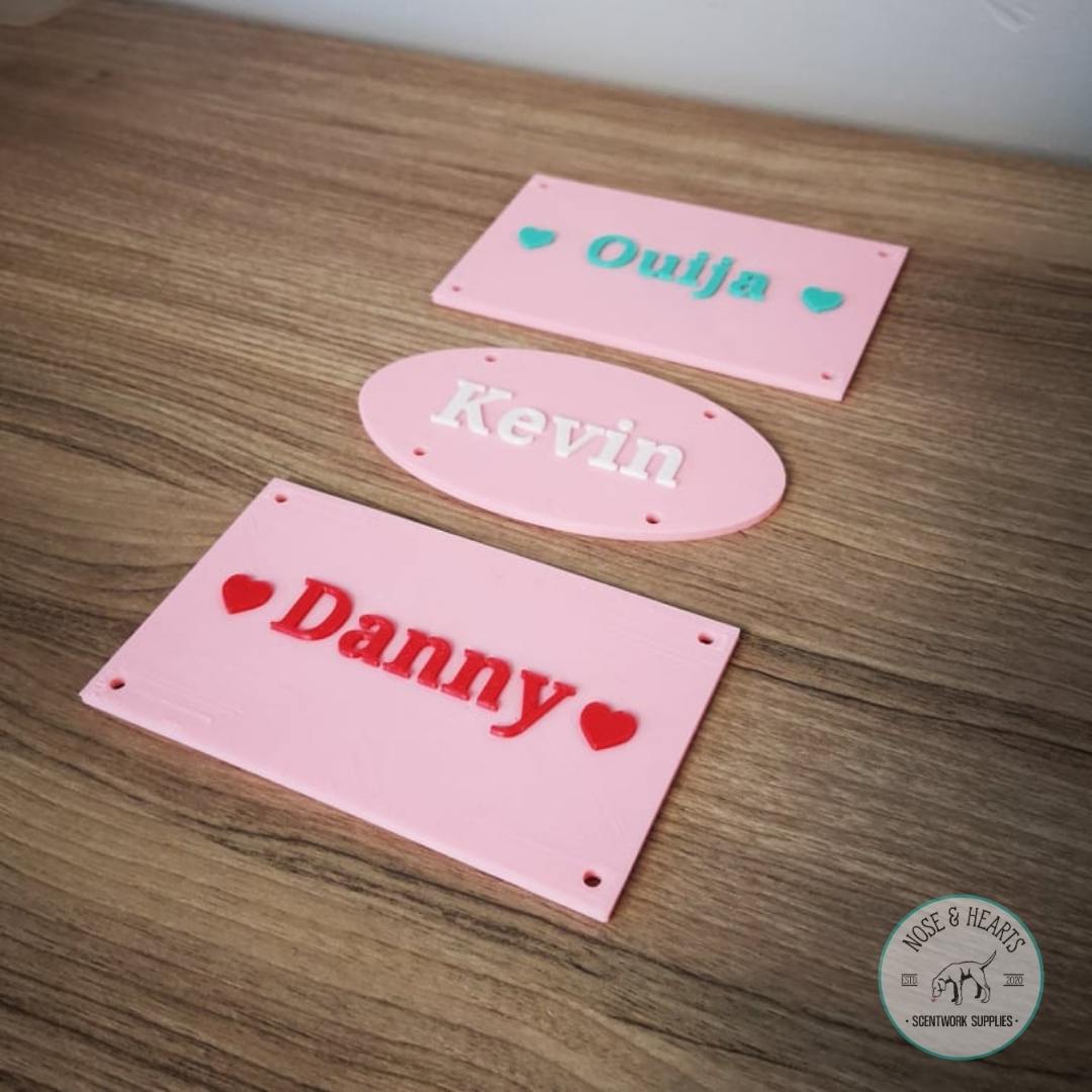 Light pink with mint, white and red font.   Ouija and Danny is in square style.   Kevin is oval style.